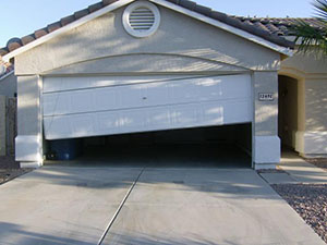 picture of a garage door that came off the track